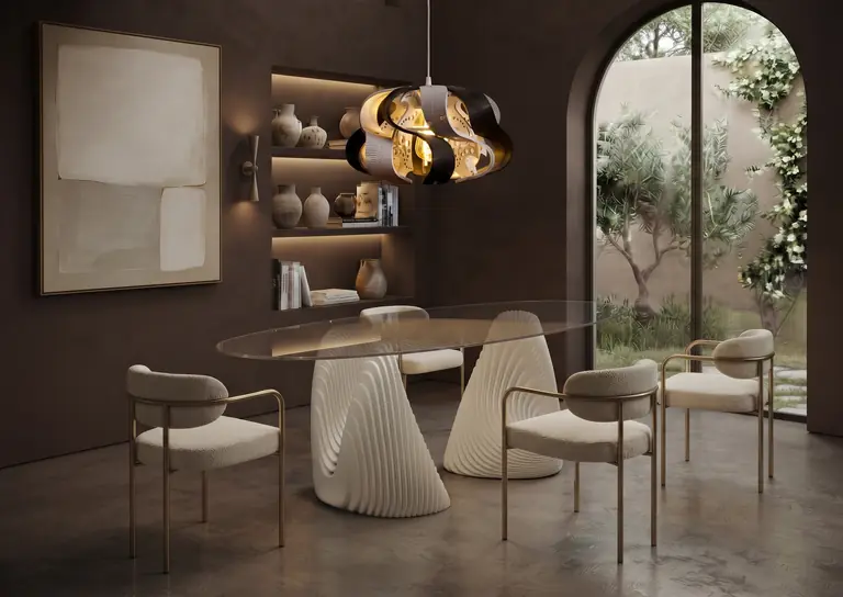 Oval glass dining table on two white rippled bases, with four chairs and a Beyond Lampshade above it in a dark dining room