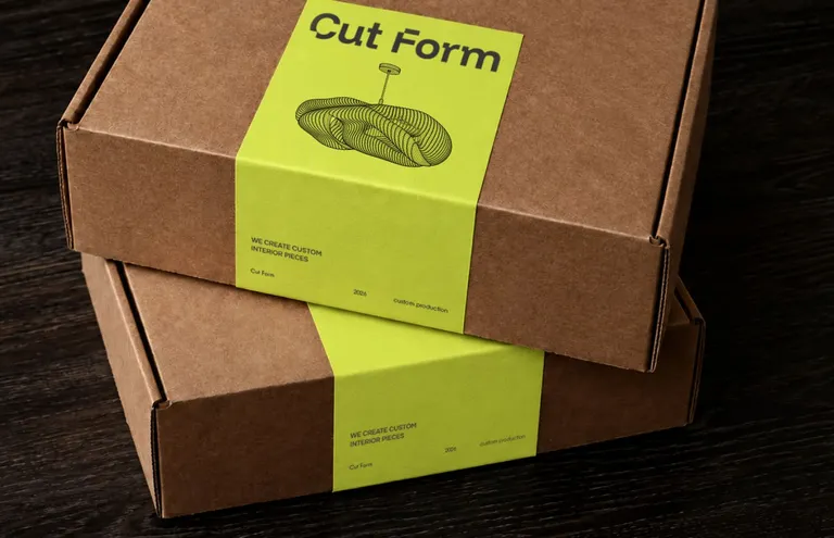 Two kraft boxes with lime Cut Form paper bands